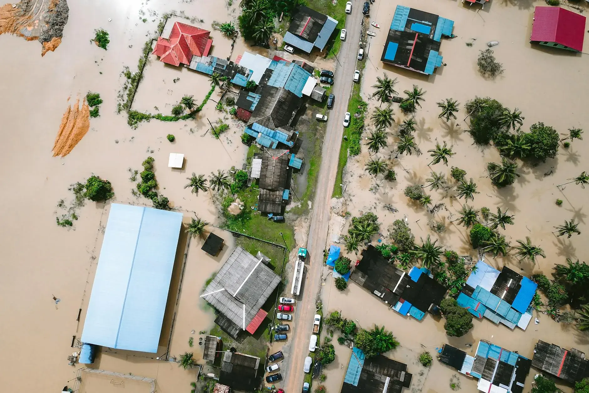 Drone footage shows submerged residential areas and damaged buildings in Kijal, Malaysia, due to severe flooding.