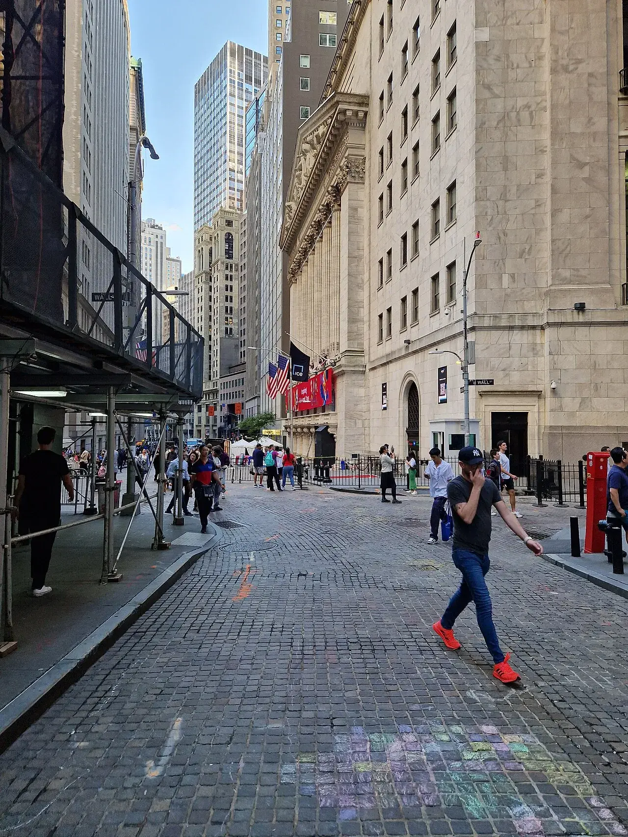 A grand view of the New York Stock Exchange building in Lower Manhattan, symbolizing financial power and historical significance.