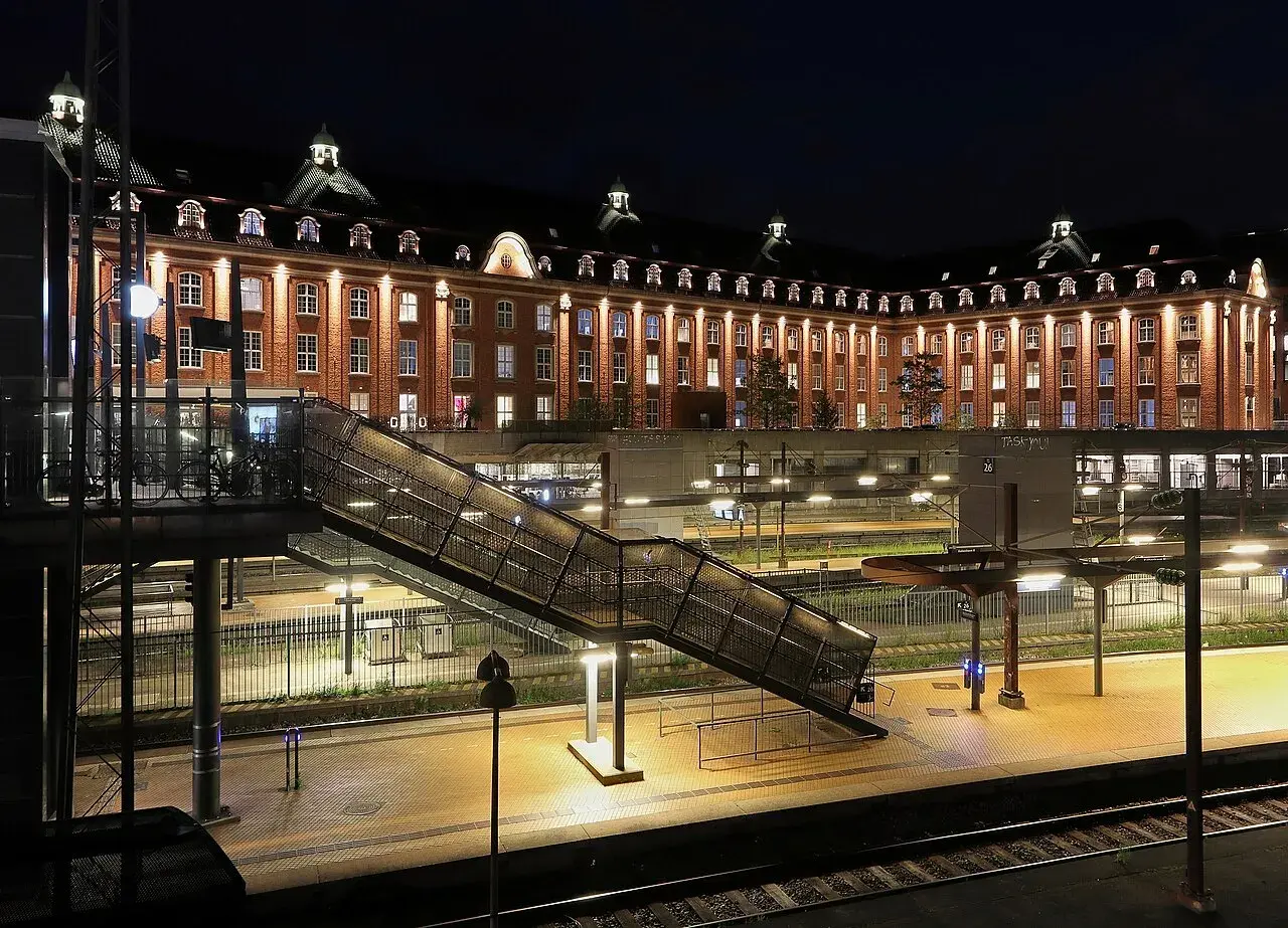 A view of the Copenhagen Central Post building and the adjacent railways station, highlighting their architectural blend.