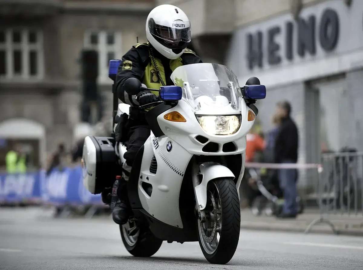 A Danish police officer rides a motorcycle during a road cycling event in Copenhagen.