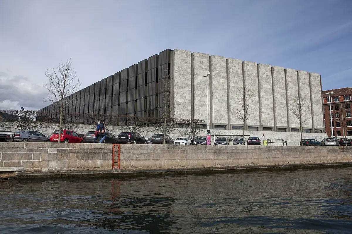 The Danmarks Nationalbank building in central Copenhagen beside a canal.