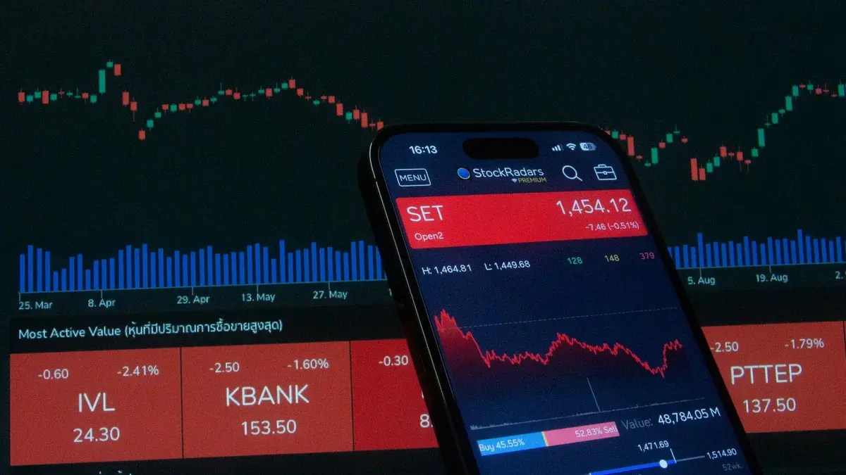 Mobile app showing stock market data with graphs