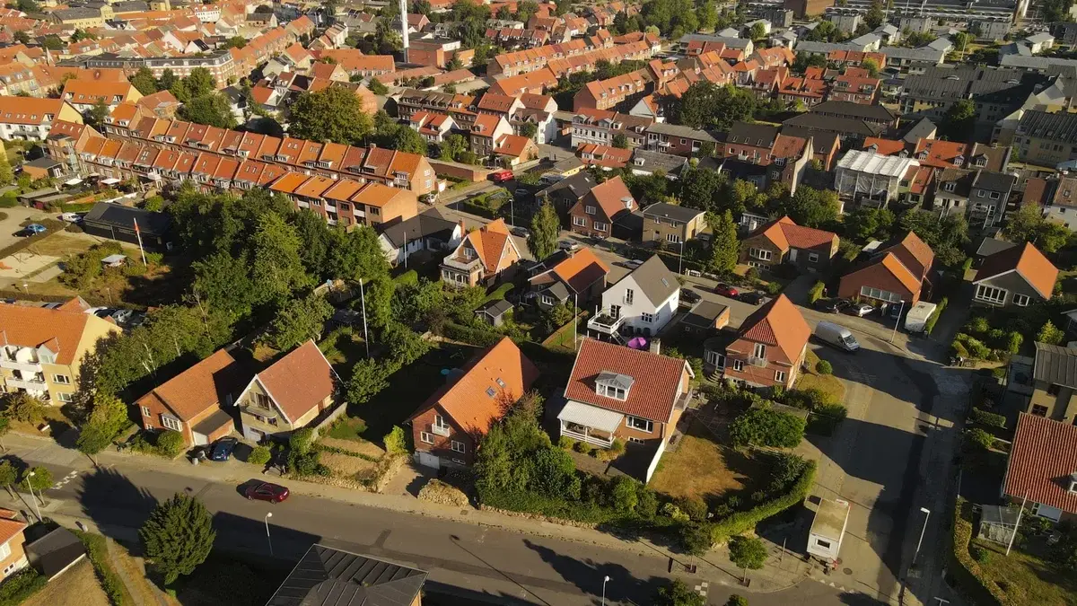Aerial view of a residential neighborhood with red-roofed houses.