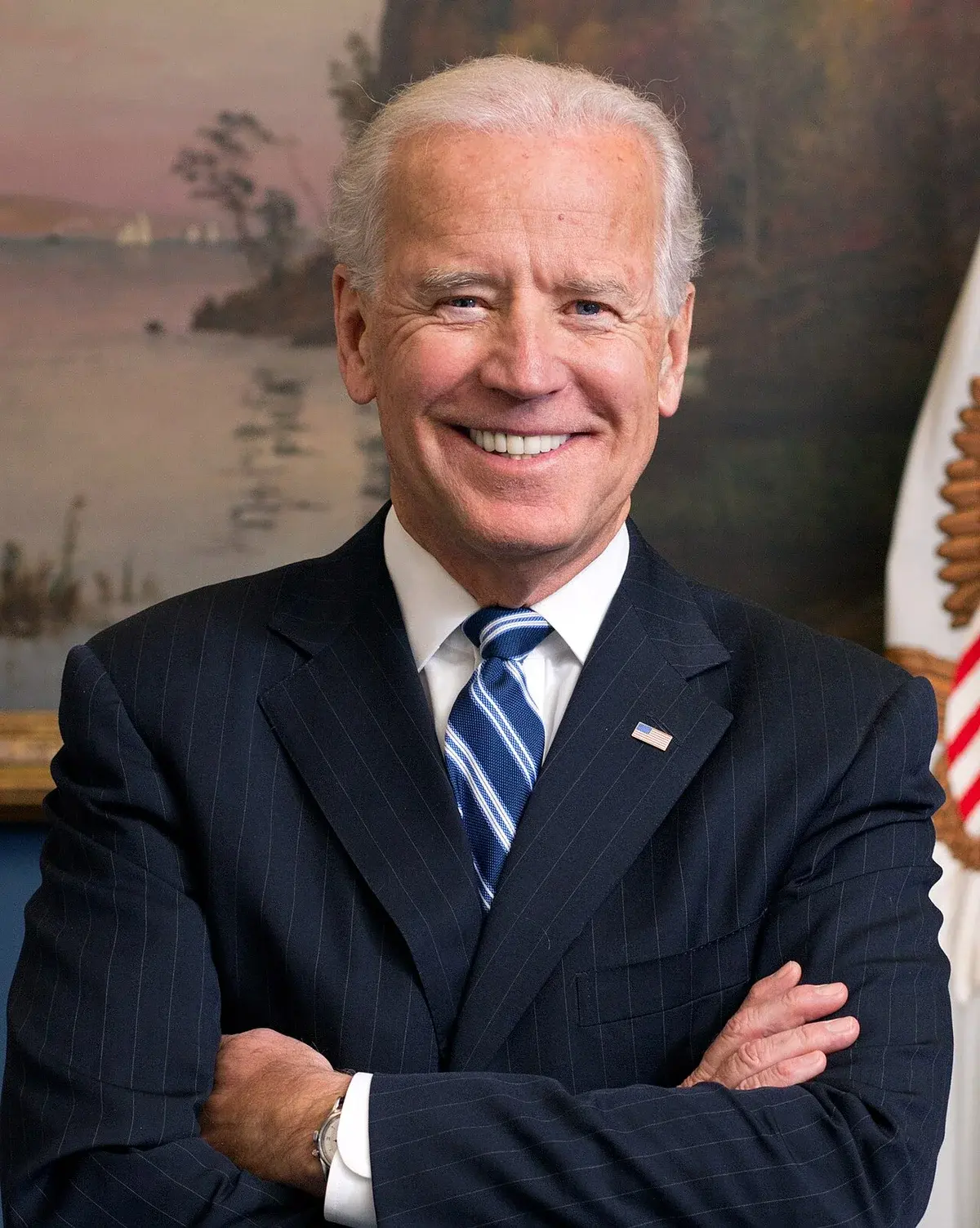 Portrait of Joe Biden in suit and tie with arms crossed