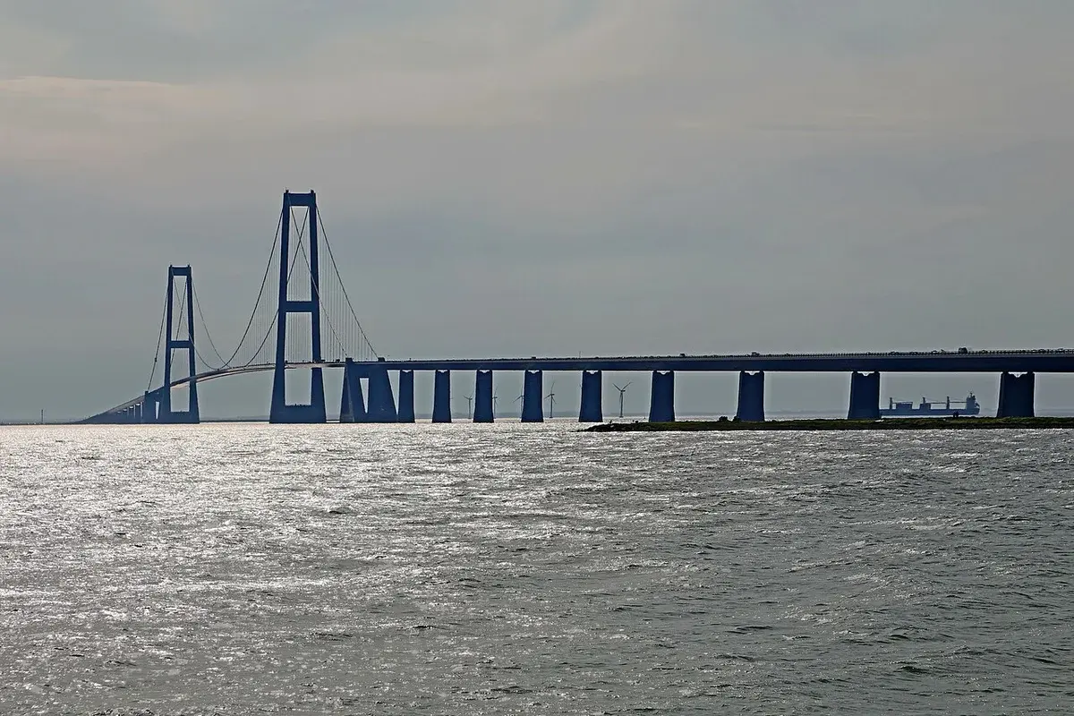 A long bridge crossing the water in Denmark.