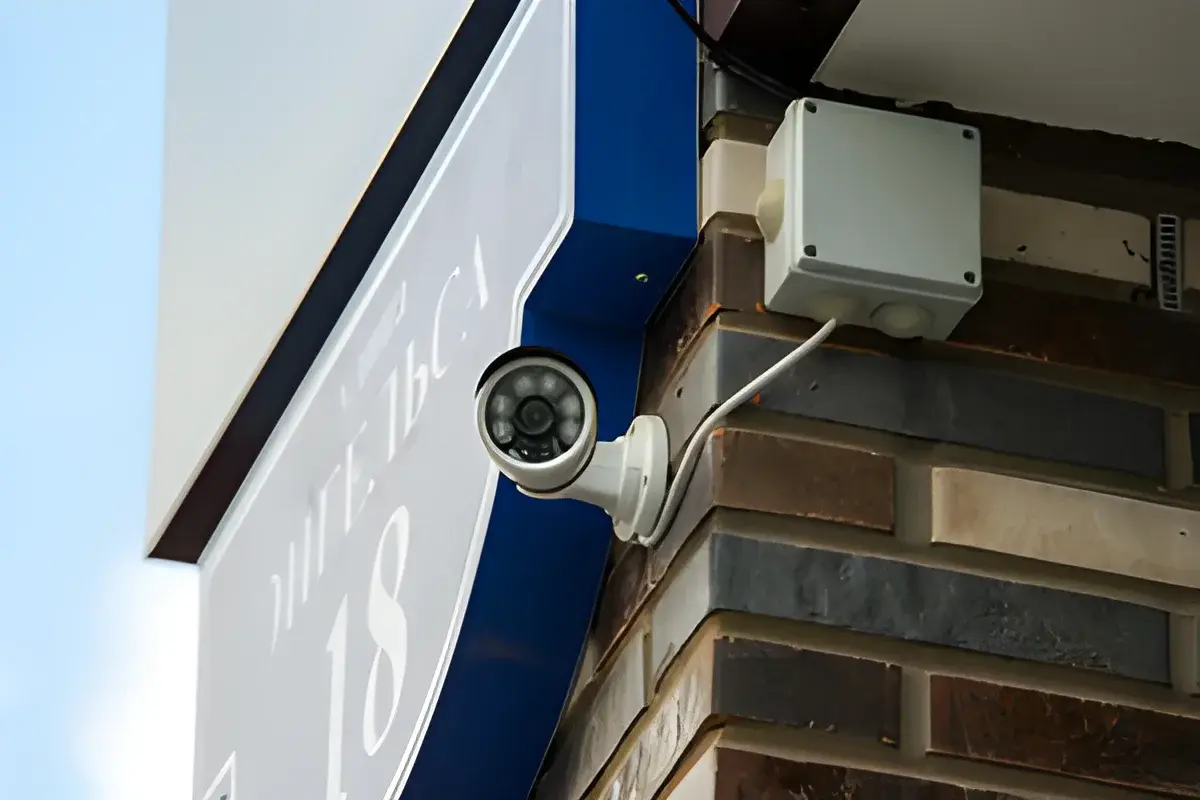 Video surveillance security camera mounted on brick wall corner