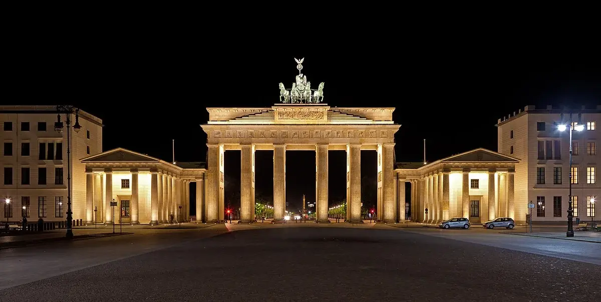 The Brandenburg Gate lit up at night in Berlin.