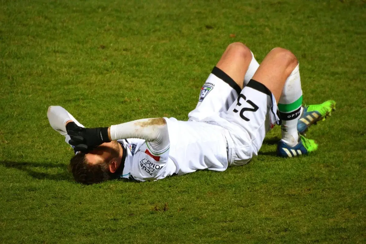 football player in pain on field
