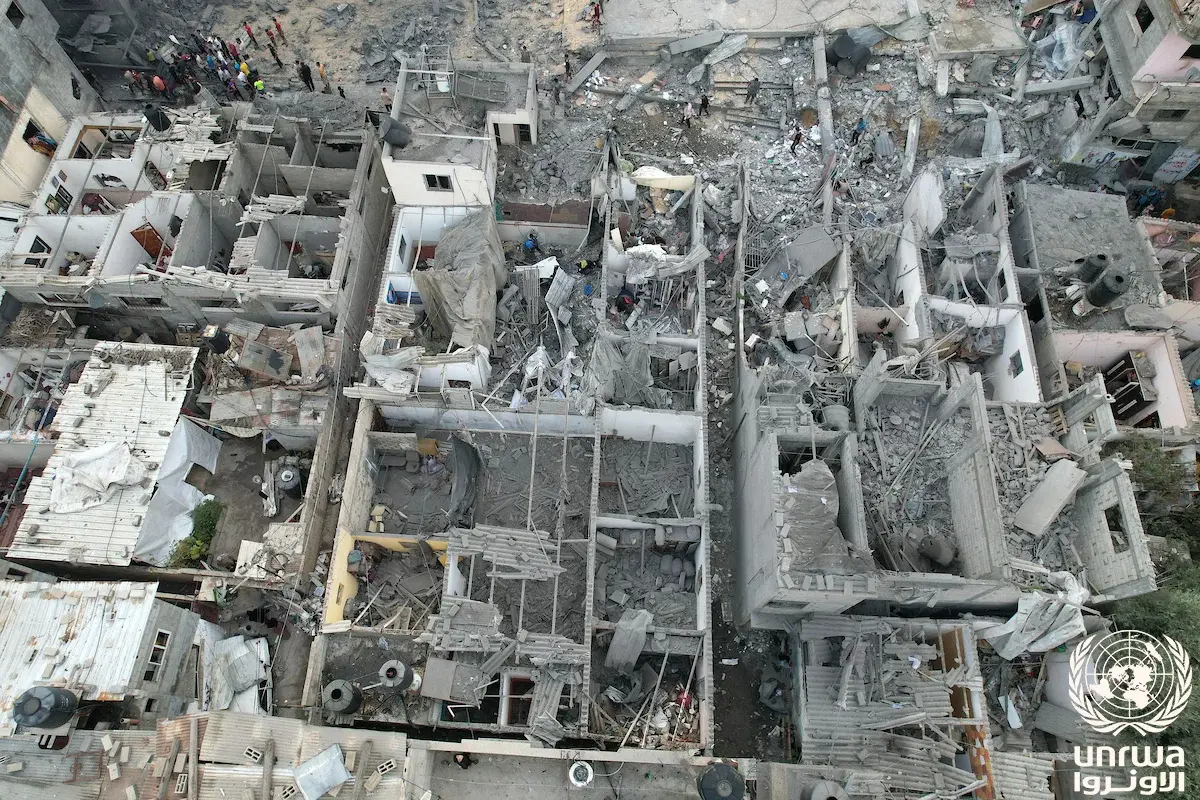 Aerial view of heavily damaged buildings and rubble in Gaza.