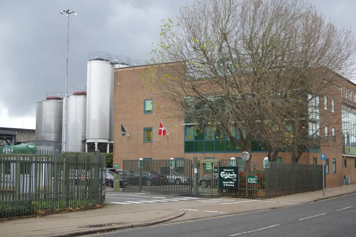 Carlsberg UK head office and brewery building with brewing tanks