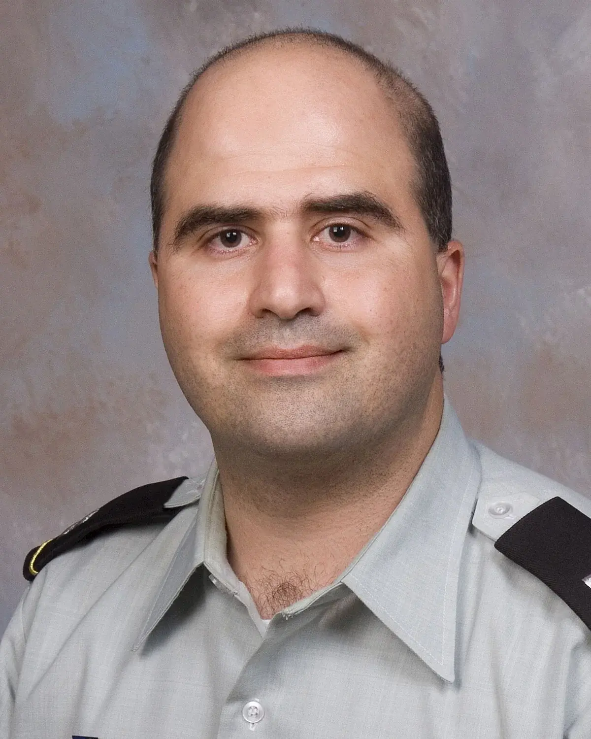 Portrait of Nidal Hasan in a U.S. Army uniform.
