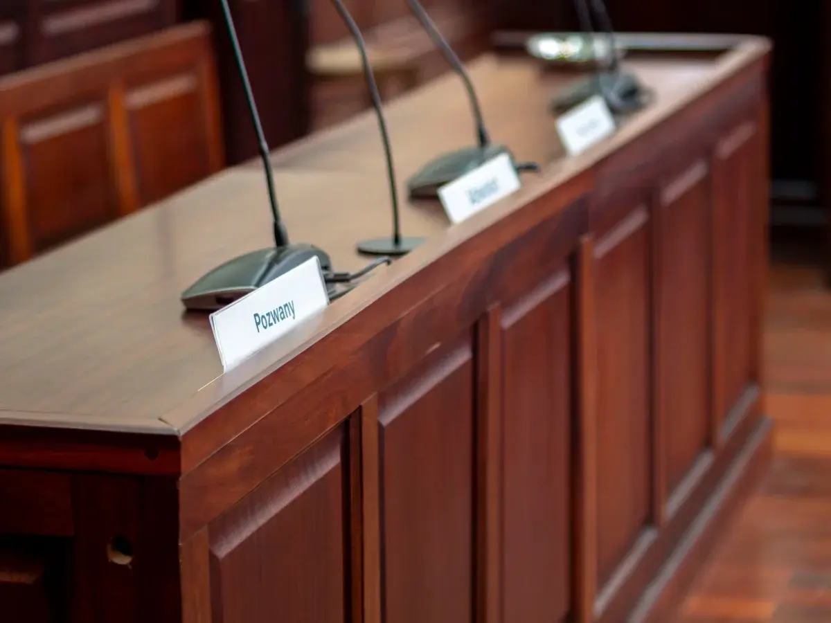 Empty Courtroom Desk with Microphones