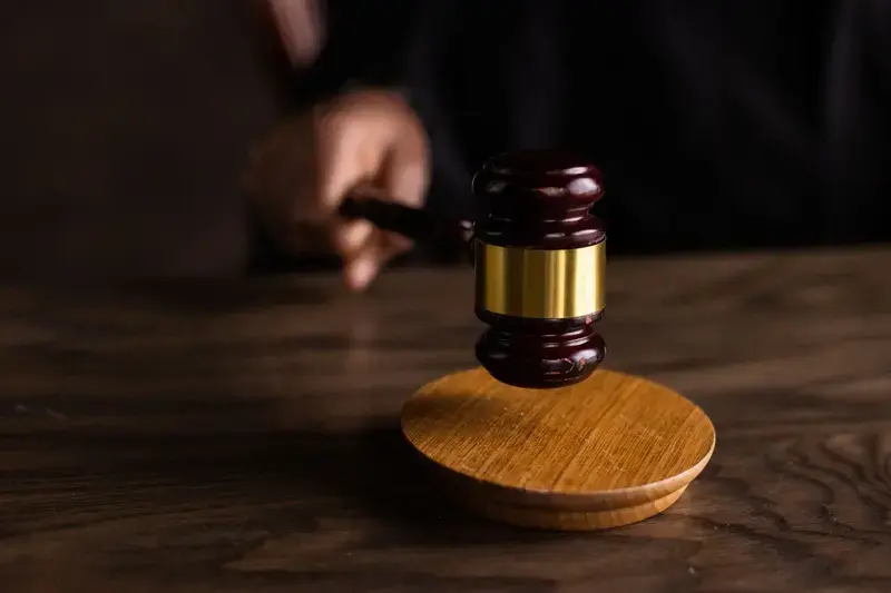 Judge's gavel striking sound block