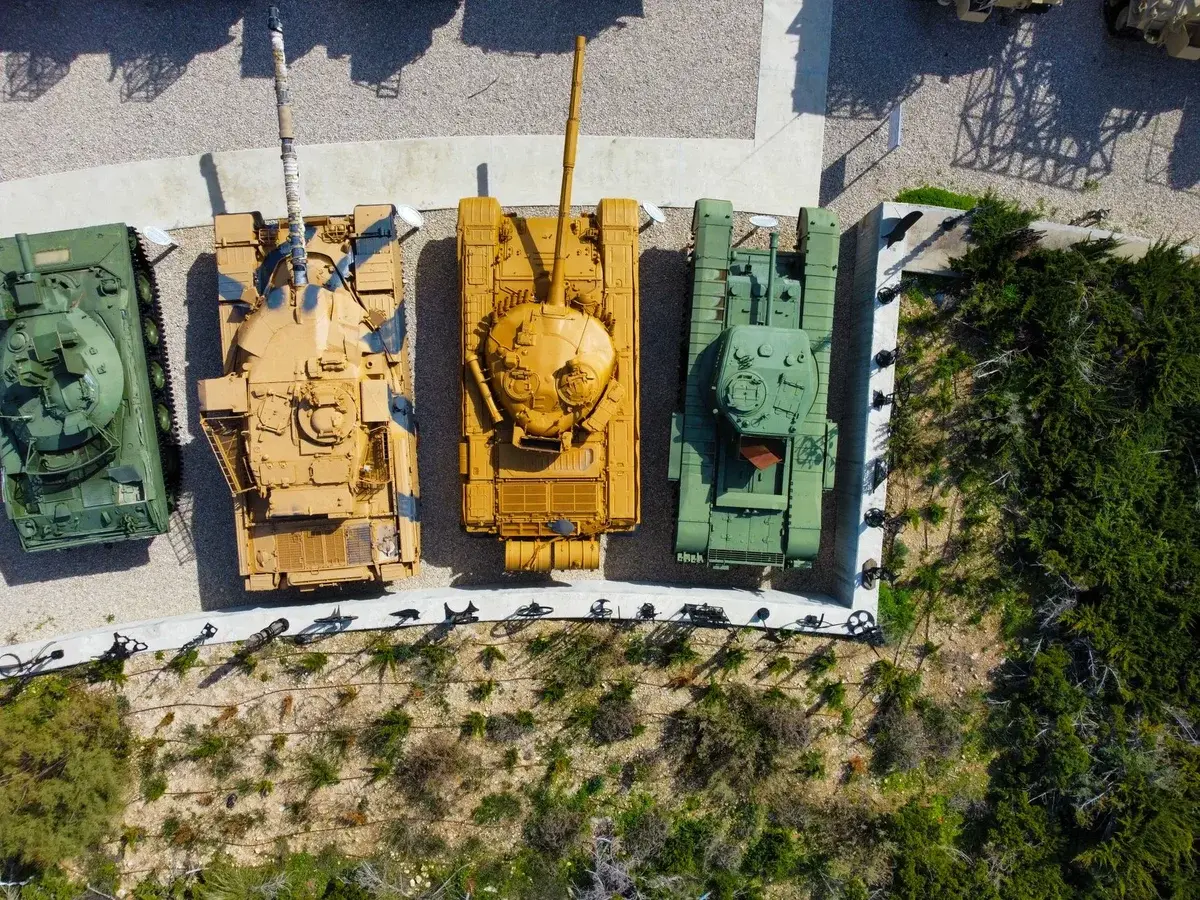Aerial view of four tanks displayed outdoors
