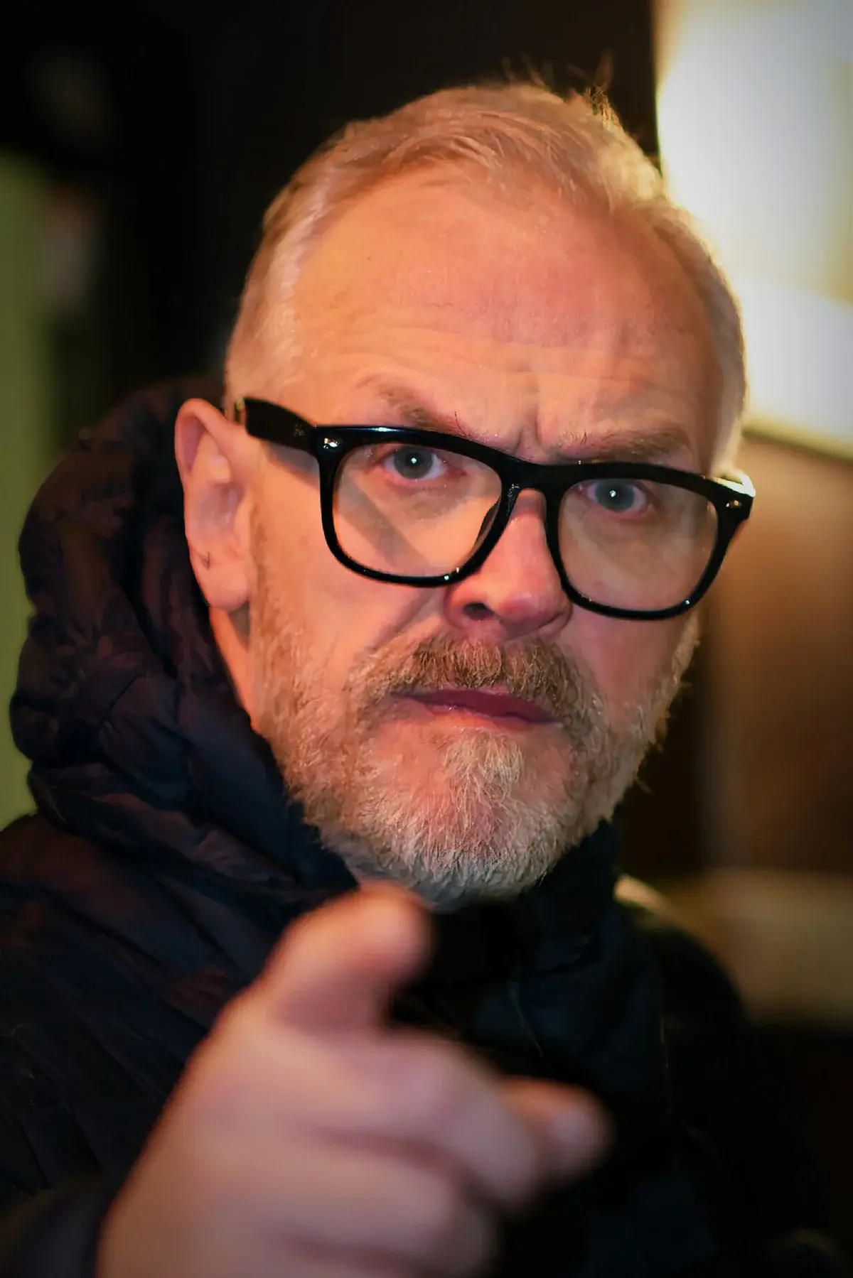 Close-up of Greg Davies pointing at the camera.