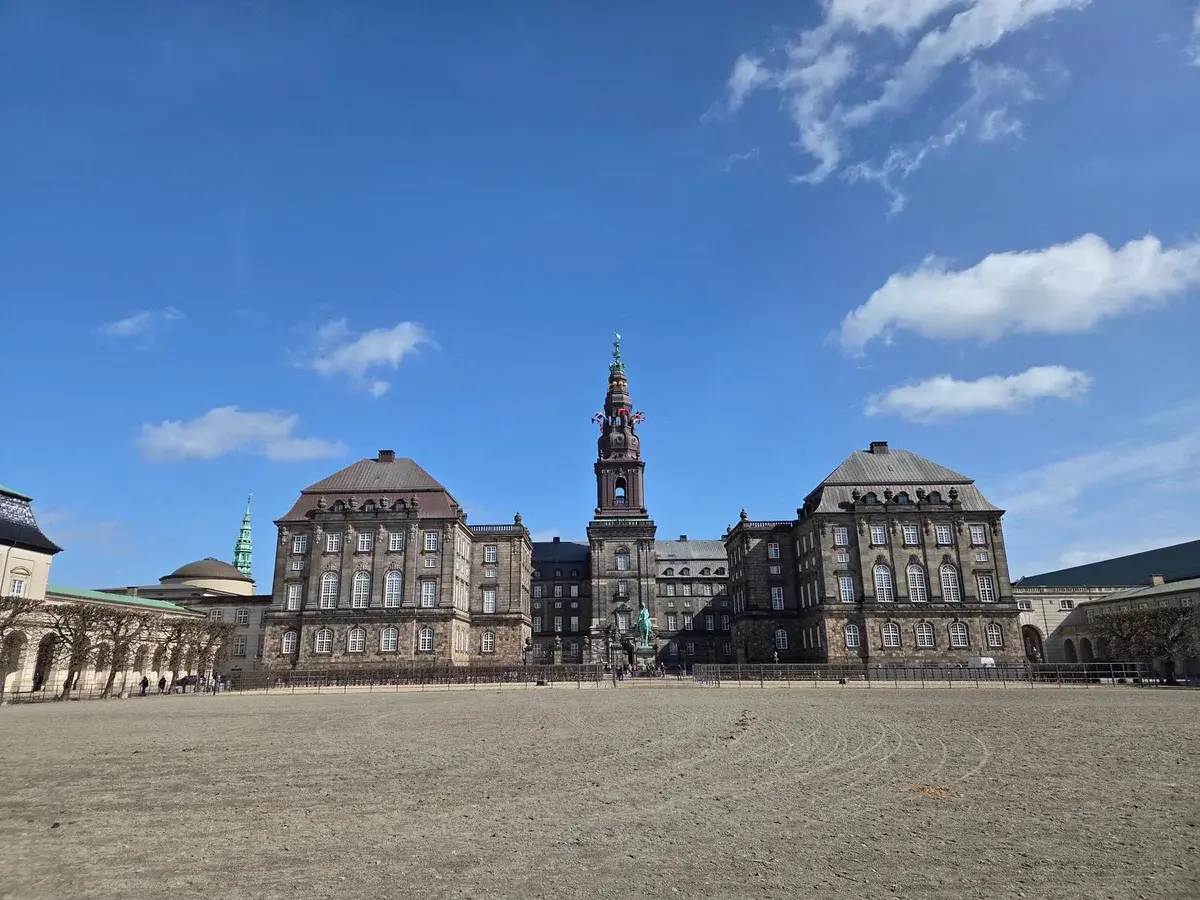 Christiansborg Palace in Copenhagen under a blue sky.