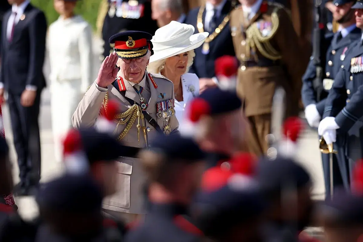 King Charles III salutes at a D-Day 80th anniversary event in France.