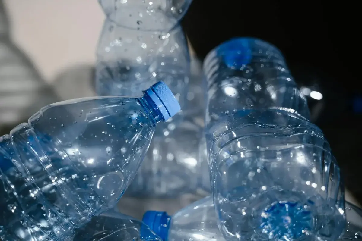 Empty plastic bottles covered in water droplets