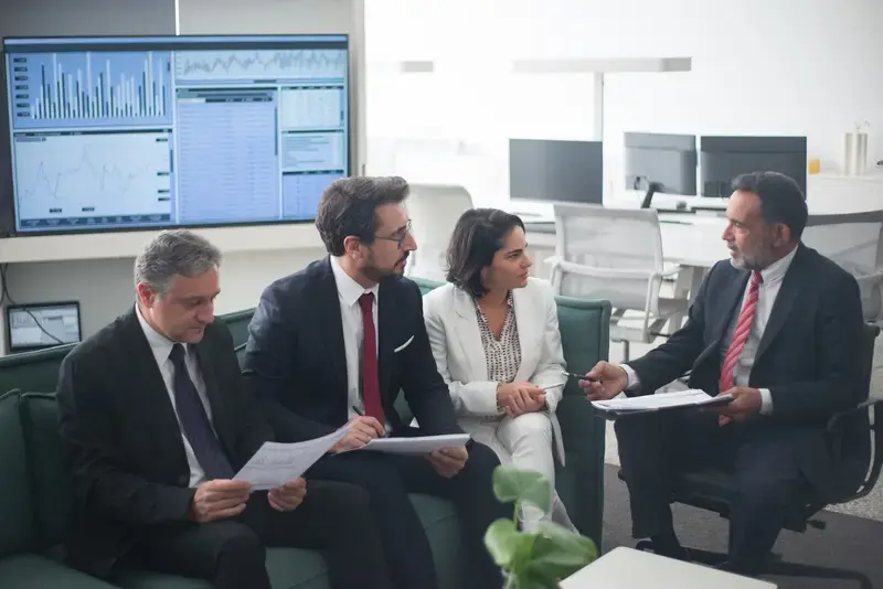 Business professionals having a meeting around financial data