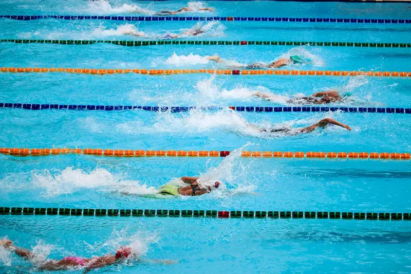 Swimmers competing in an outdoor swimming race