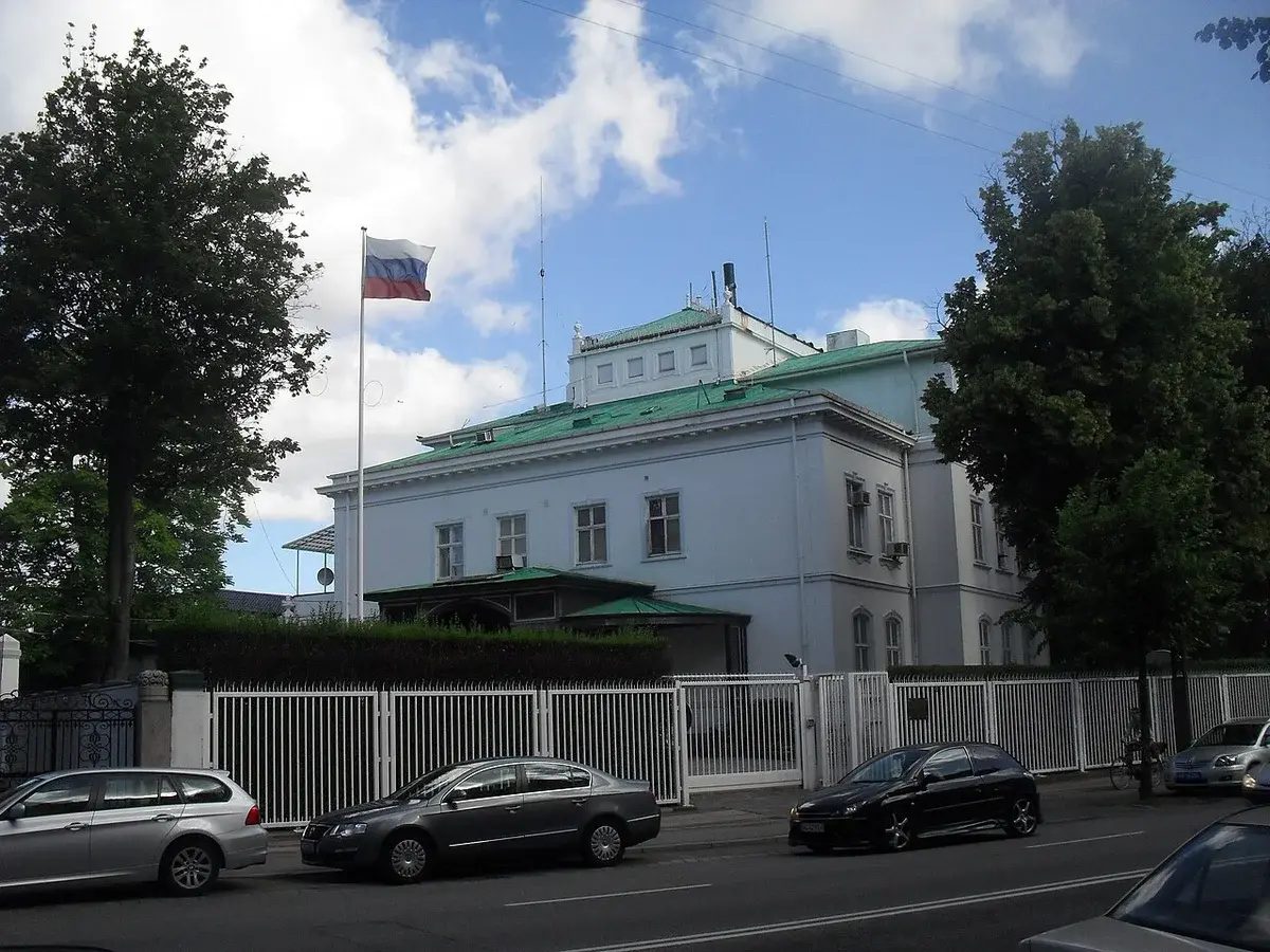 Exterior view of the Russian Embassy in Copenhagen with a Russian flag flying outside.