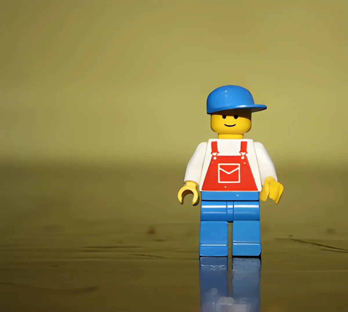 Lego figure with blue cap and red overalls
