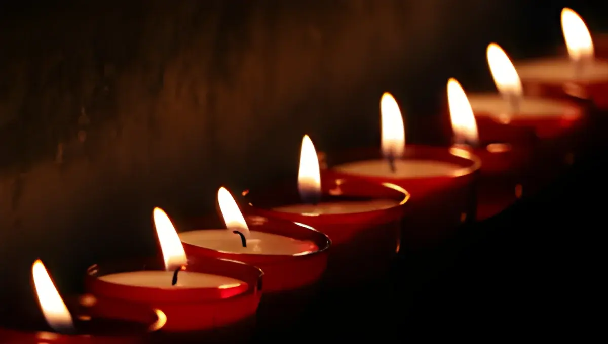 lit tealight candles in red holders
