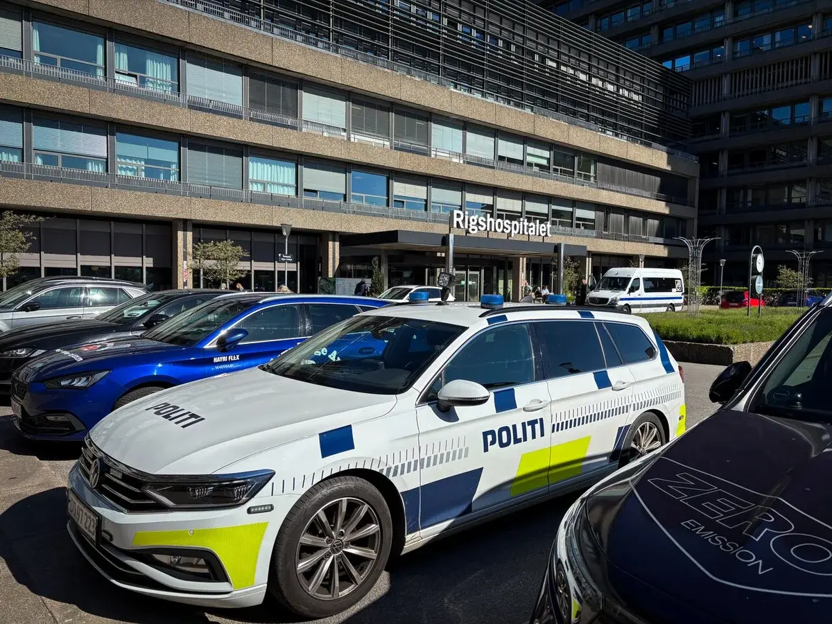 Danish police car parked in front of Rigshospitalet hospital entrance