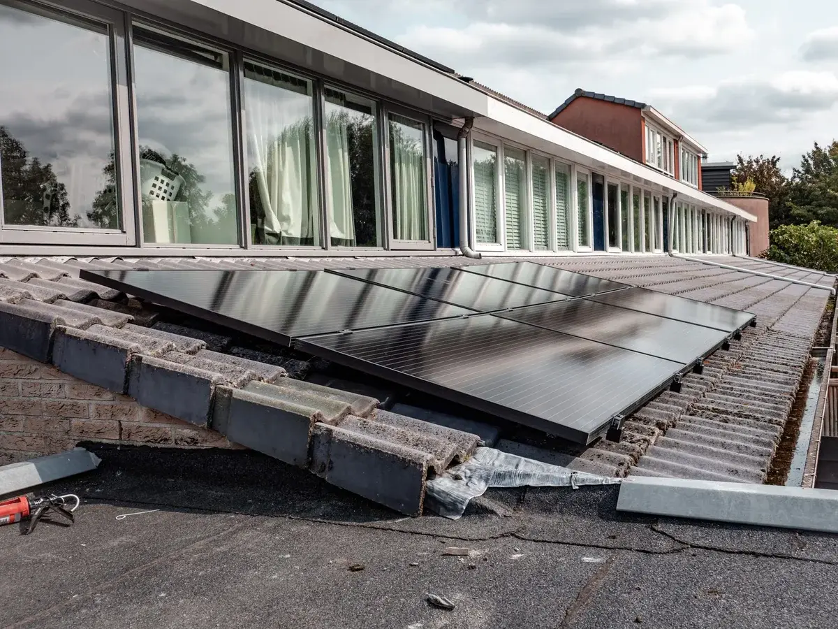 Solar panels installed on the roof of a modern house.