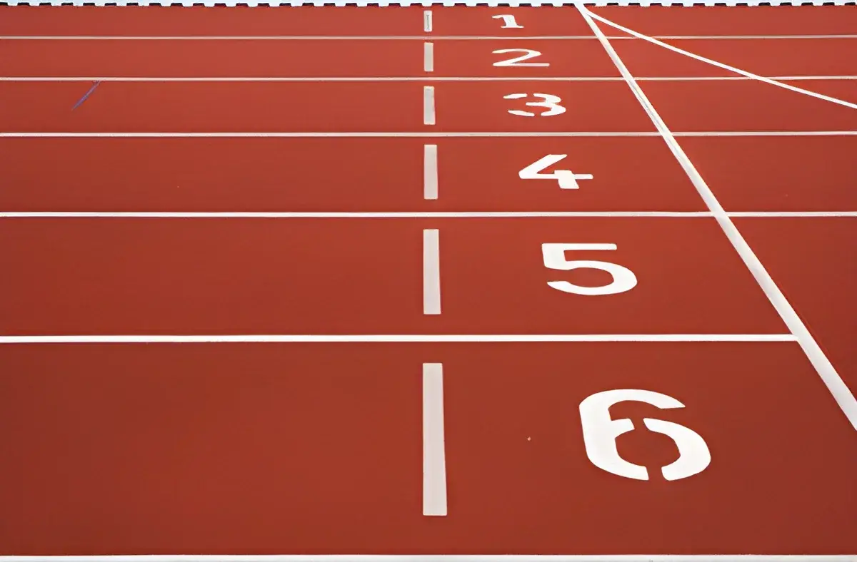 section of an outdoor running track with lane numbers 1 to 6