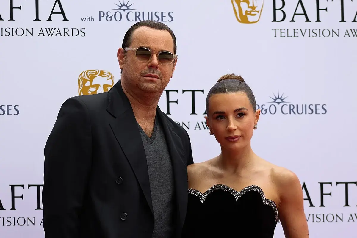 Danny Dyer and Dani Dyer posing on the BAFTA Television Awards red carpet.