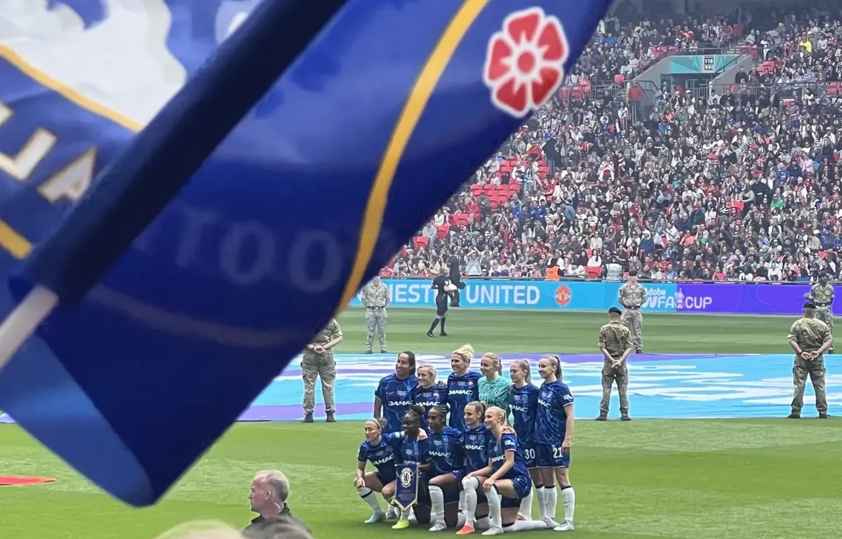 Chelsea FC Women posing on the pitch at Wembley during the FA Cup final.